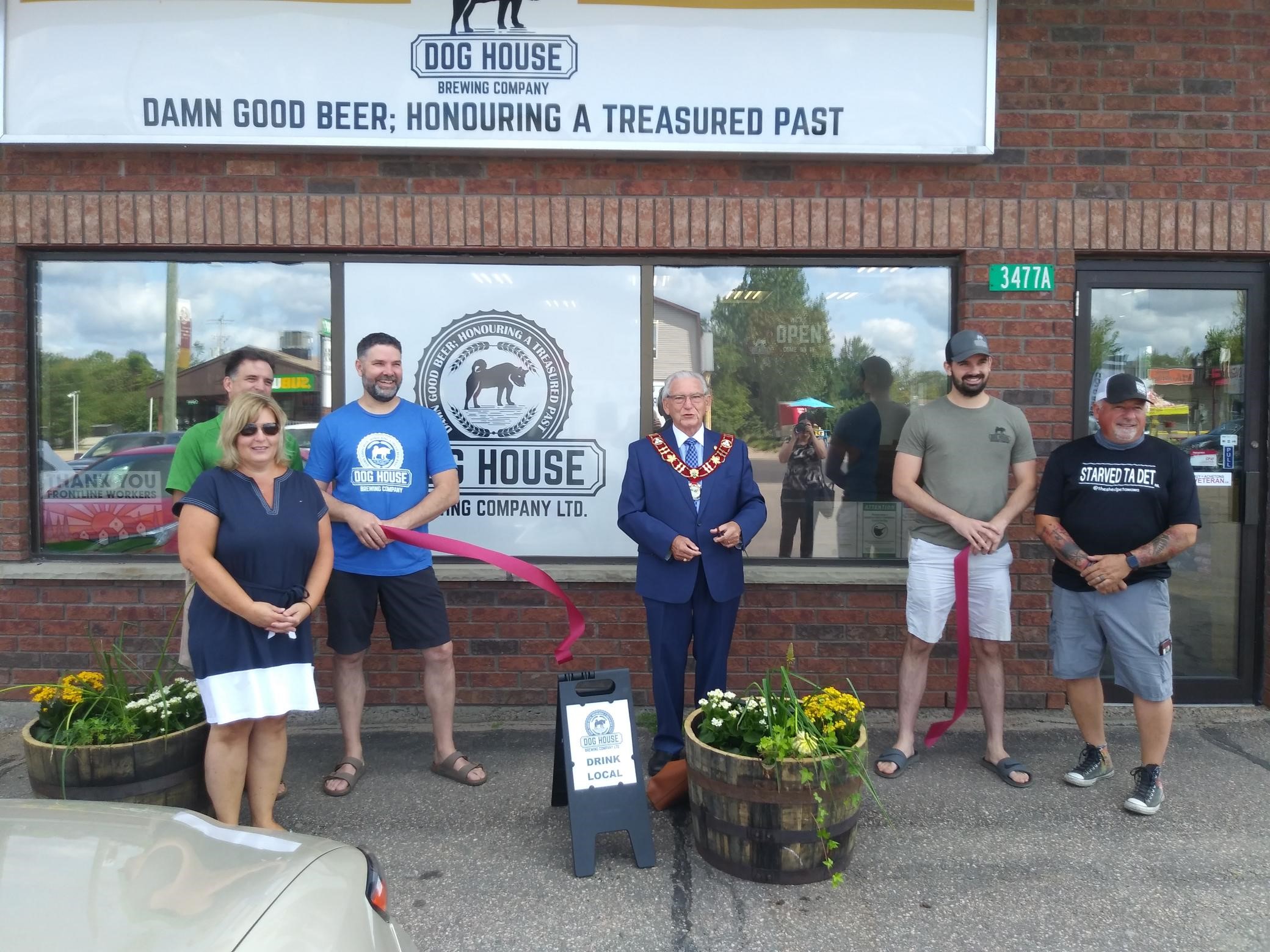 image of ribbon cutting with members of PBAN