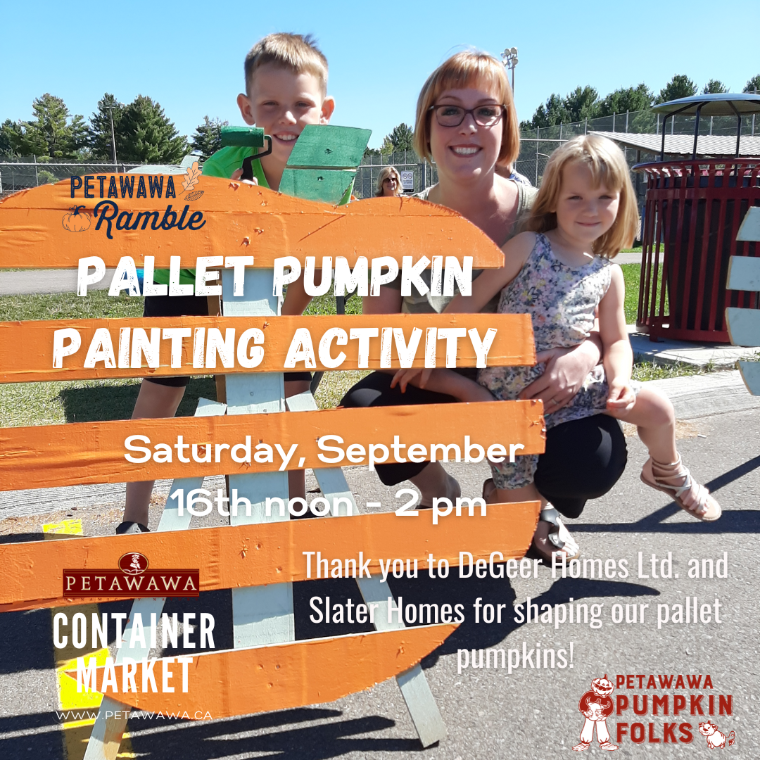 A woman and two children, male and female beside a pumpkin pallet