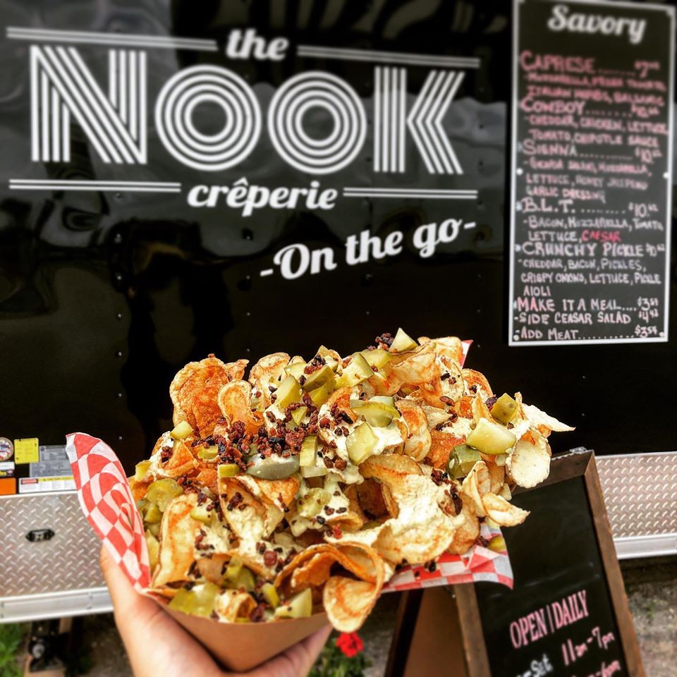 Image of Nook on the Go pickle fries in front of food truck and menu