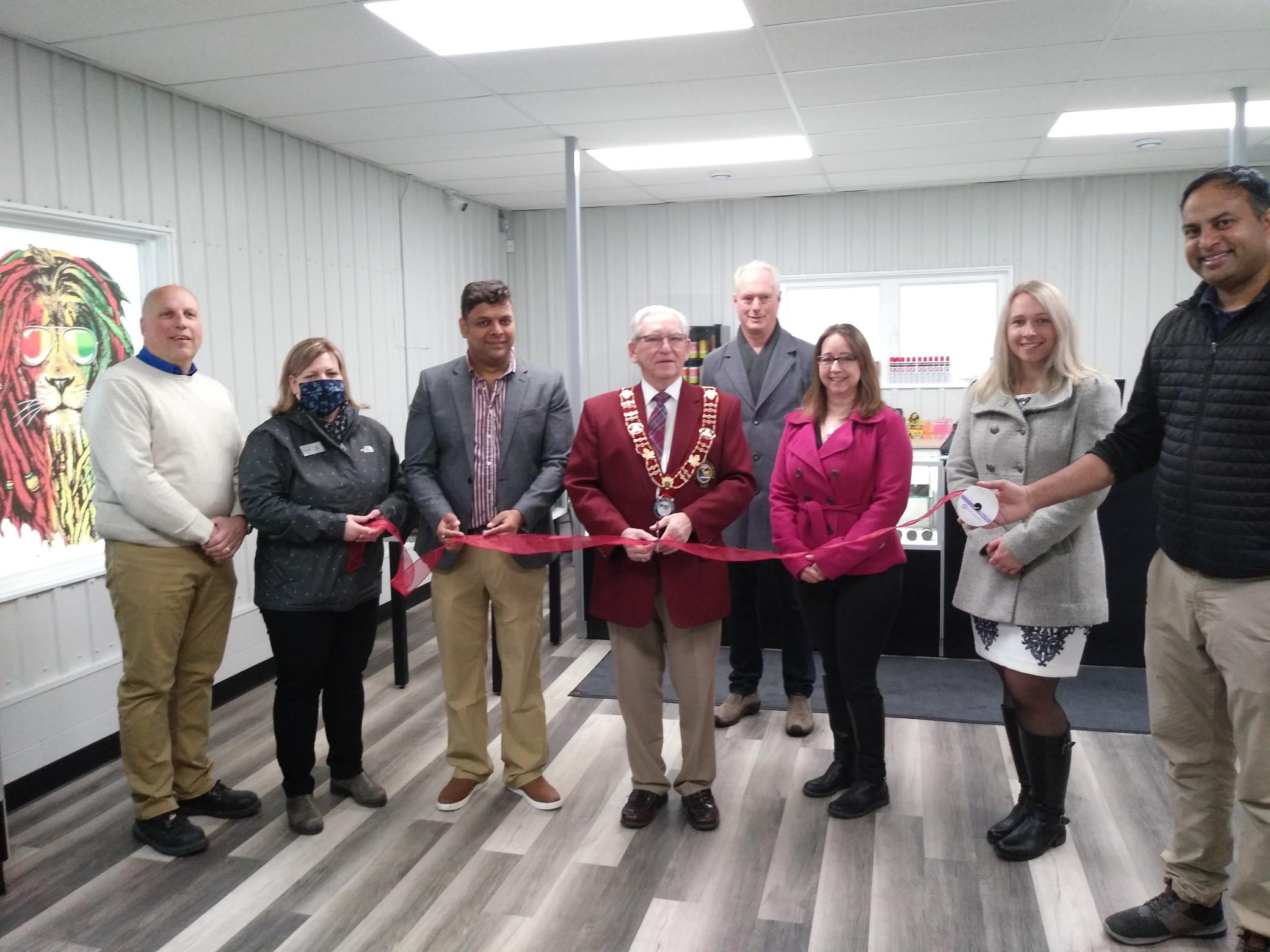 Councillor Rutz, Val Hyska, Nitin Aggarwal, Mayor Sweet, Councillor Carmody, Christina McFadden, Cindy Sell and Sai Alluru ribbon cutting image